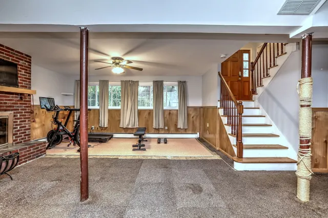 a view of a livingroom with gym equipment