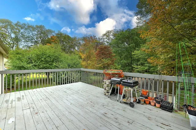a view of a balcony with wooden floor