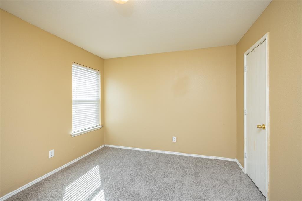 112 Bushel Lane Dallas, TX 75241 - Photo 11 of 16 a view of an empty room with a window