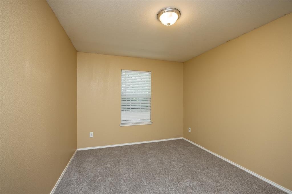 112 Bushel Lane Dallas, TX 75241 - Photo 12 of 16 an empty room with a window