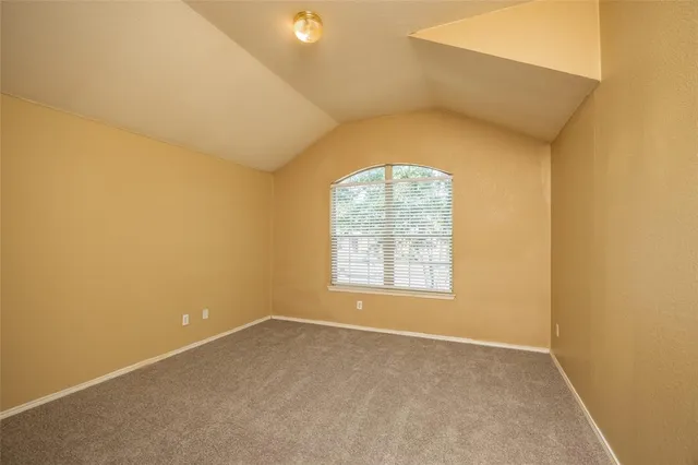 an empty room with a empty space and windows