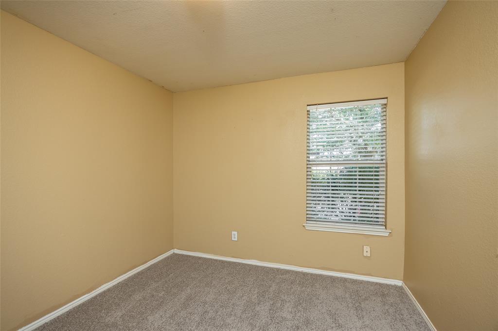 112 Bushel Lane Dallas, TX 75241 - Photo 10 of 16 a view of an empty room with a window