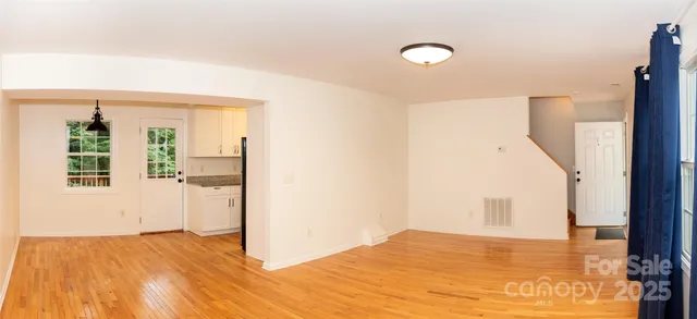 a view of an empty room and window