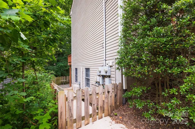 a view of house with a tree