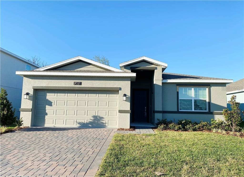 2021 Mountain Pine Street Ocoee, FL 34761 - Photo 1 of 1 a front view of a house with a garden