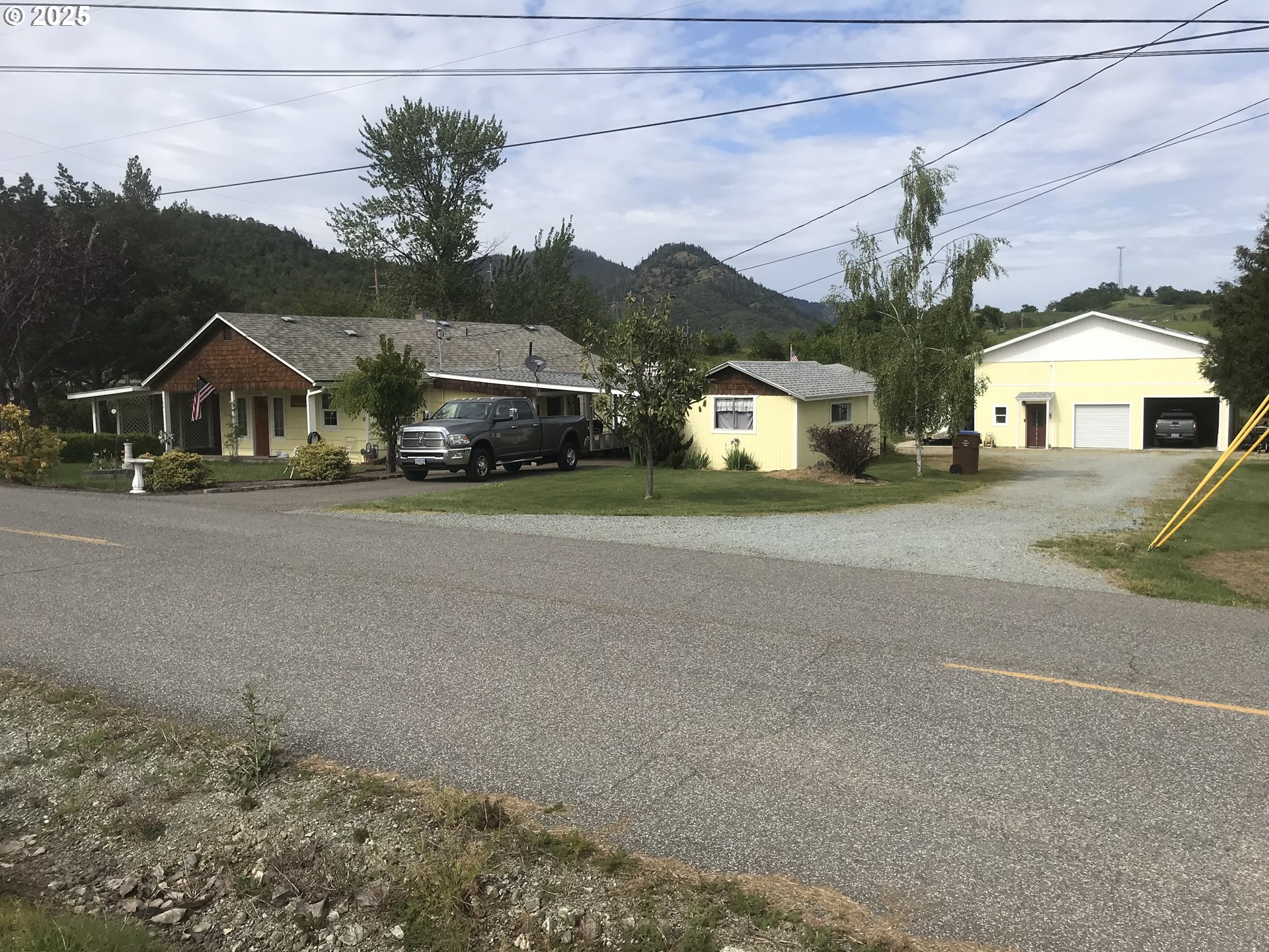 a view of a house with a street