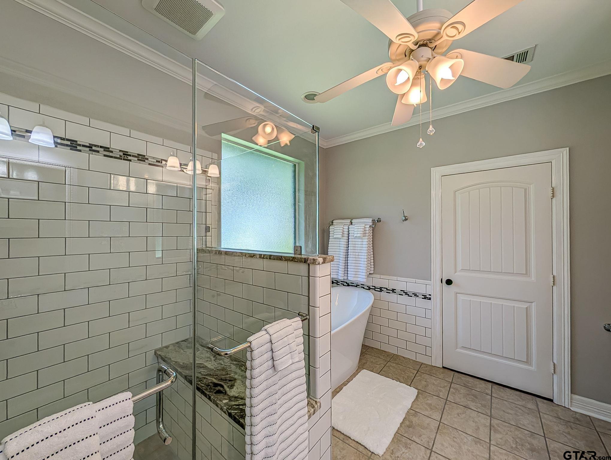 18488 Bluebird Circle Flint, TX 75762 - Photo 26 of 47 a bathroom with a light fixture a toilet and a shower