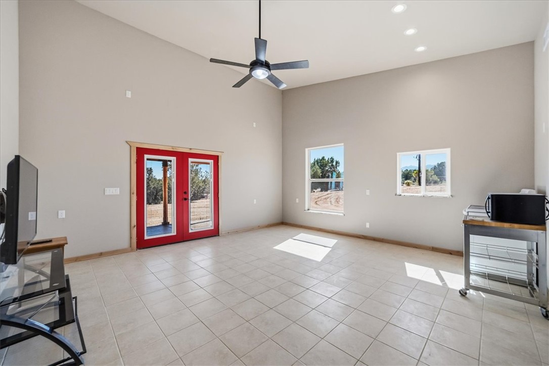 10374 East Happy Trails Road Kingman, AZ 86401 - Photo 25 of 68 a view of livingroom with furniture fan and window