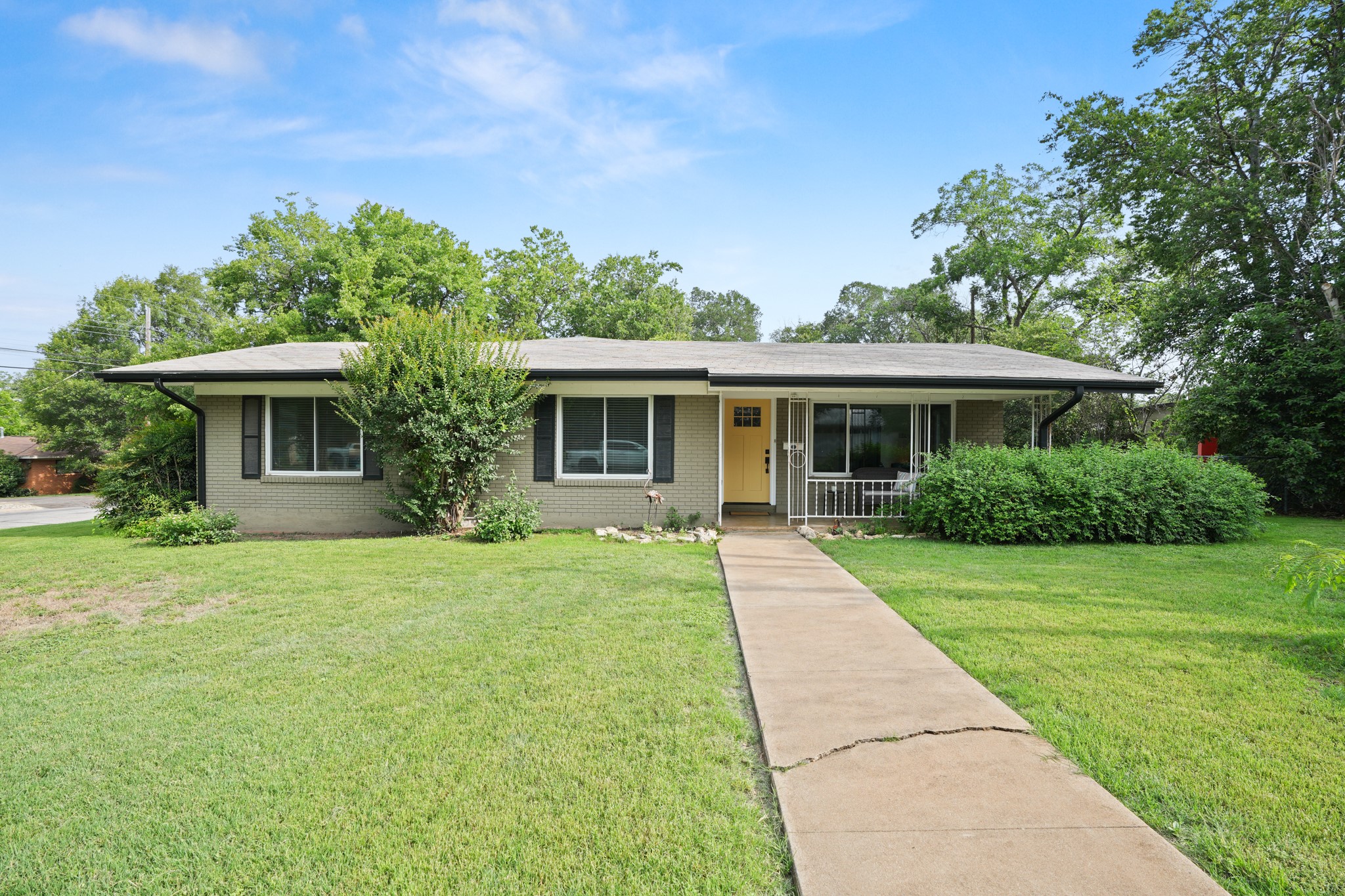 4702 Lasso Path Austin, TX 78745 - Photo 37 of 38 A well-kept front yard leads to a charming all-brick exterior.