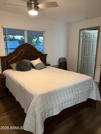 a bedroom with a bed and window
