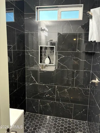 a bathroom with a sink and a shower