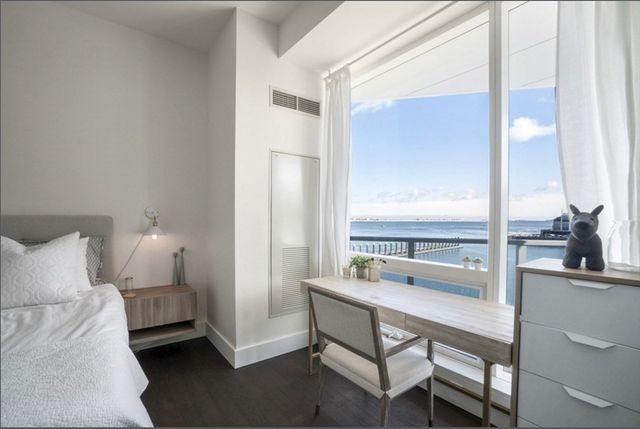 a room with a bed a table and chair