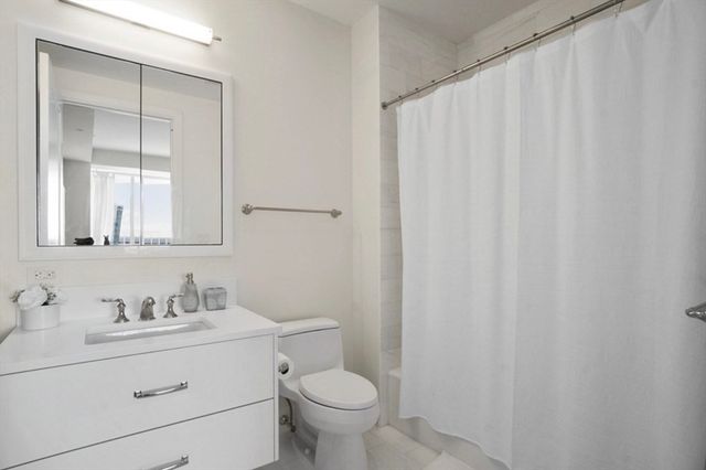 a bathroom with a sink toilet and vanity