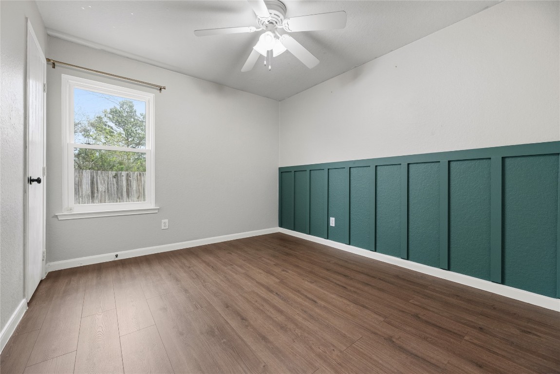 24006 Lazy Kay Lane Hockley, TX 77447 - Photo 15 of 21 a view of an empty room with wooden floor and a window