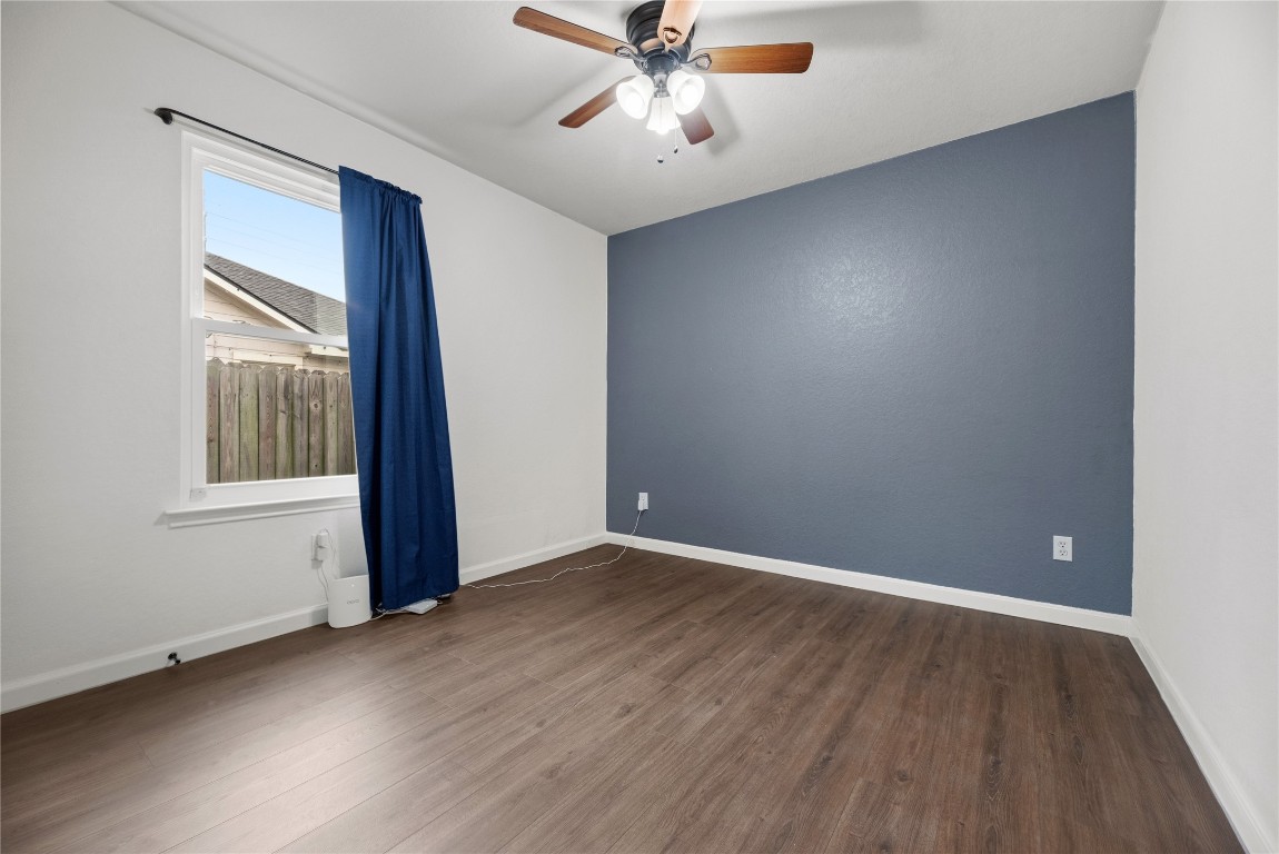 24006 Lazy Kay Lane Hockley, TX 77447 - Photo 17 of 21 wooden floor in an empty room with a window