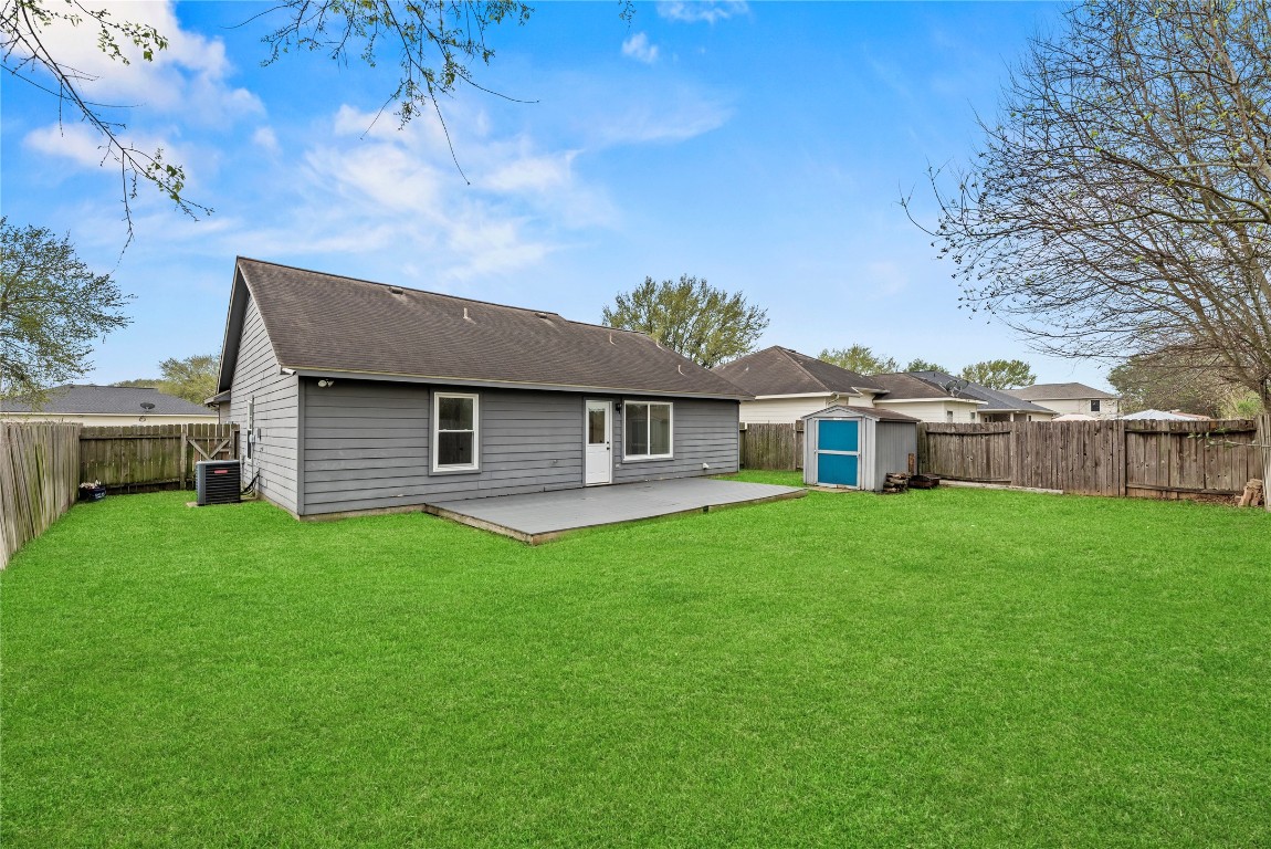 24006 Lazy Kay Lane Hockley, TX 77447 - Photo 20 of 21 a front view of a house with a garden