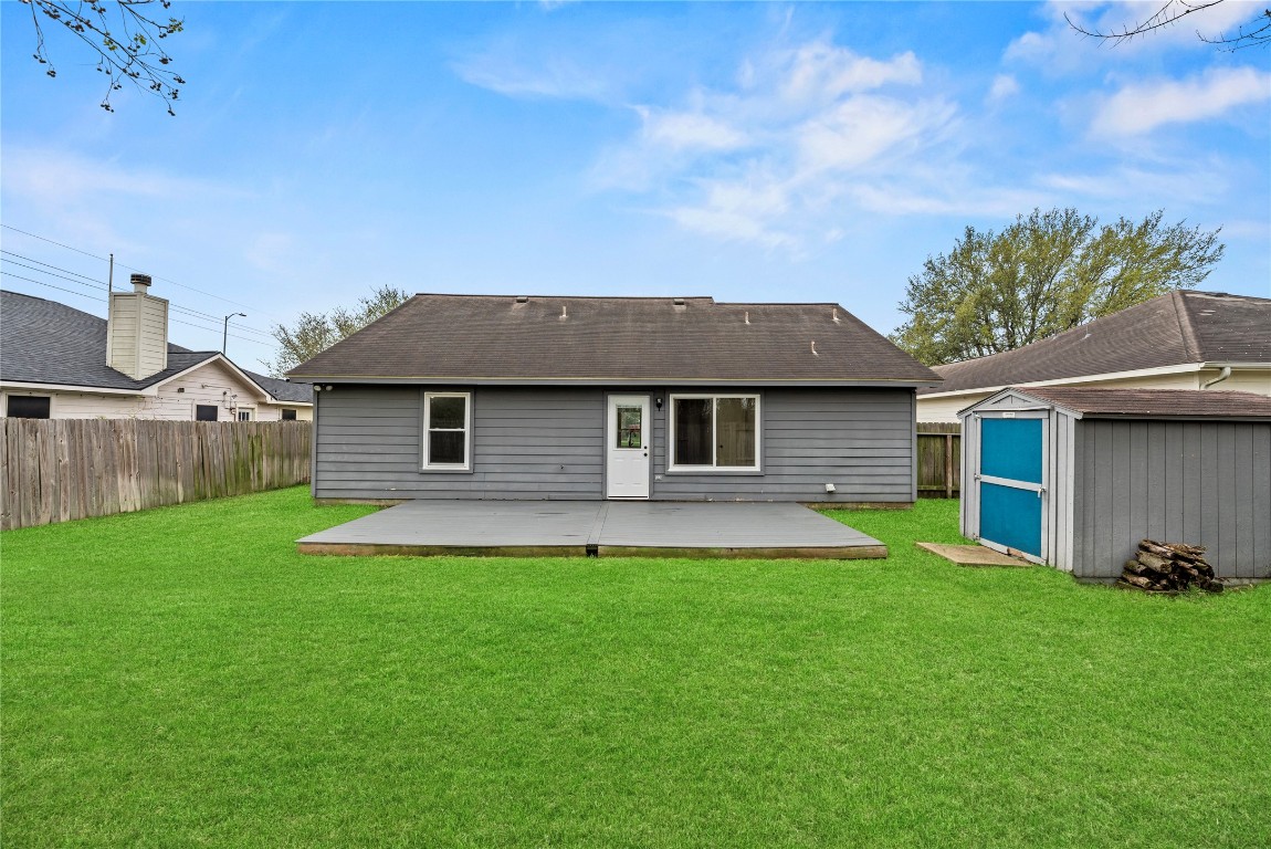 24006 Lazy Kay Lane Hockley, TX 77447 - Photo 21 of 21 a front view of a house with a yard and garage