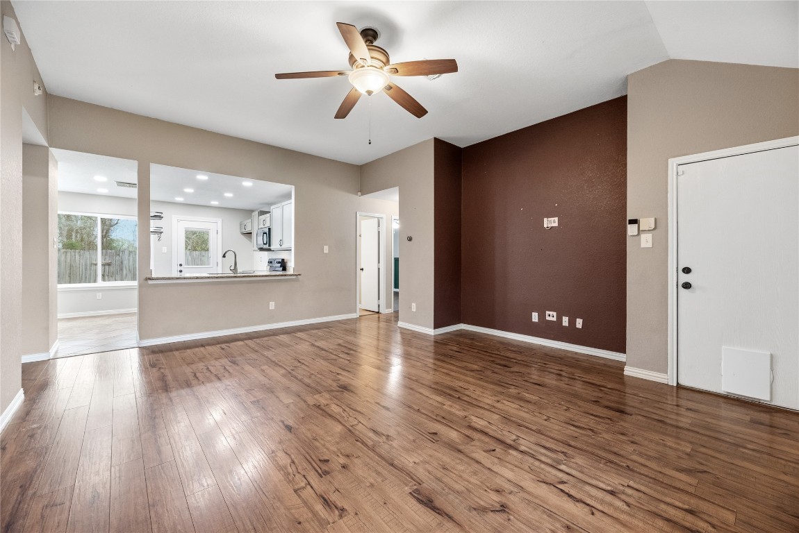 24006 Lazy Kay Lane Hockley, TX 77447 - Photo 5 of 21 a view of an empty room with a window and wooden floor