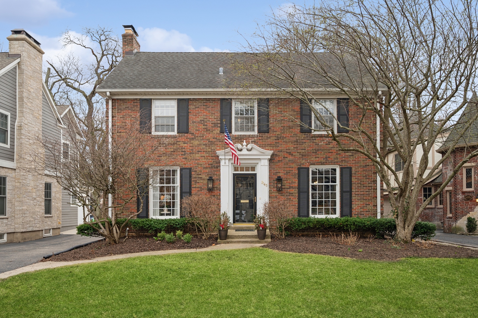 front view of a house with a yard