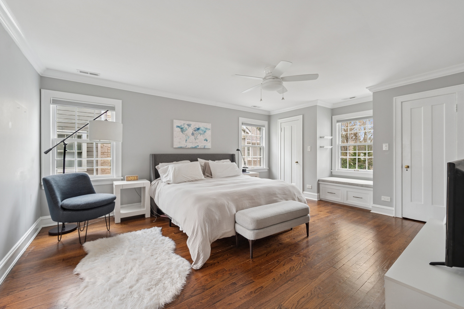 2145 Chestnut Avenue Wilmette, IL 60091 - Photo 20 of 38 a spacious bedroom with a bed a couch and a window with wooden floor