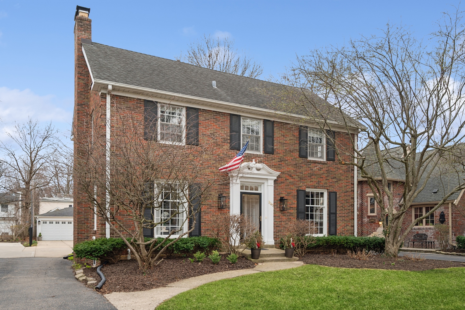 2145 Chestnut Avenue Wilmette, IL 60091 - Photo 33 of 38 a front view of a house with garden
