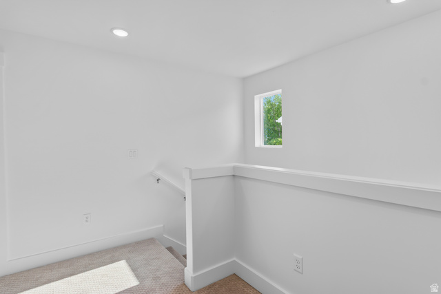 1237 West 500 South, Unit 230 Logan, UT 84321 - Photo 19 of 42 Recessed ceiling lighting, white painted walls, natural light from a window, and carpeted flooring