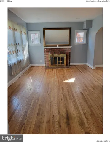 a view of a livingroom with furniture and window