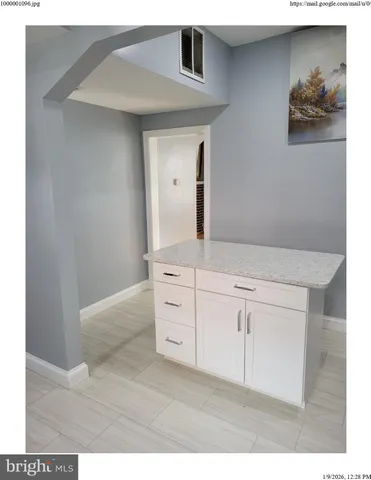 a kitchen with cabinets and stainless steel appliances