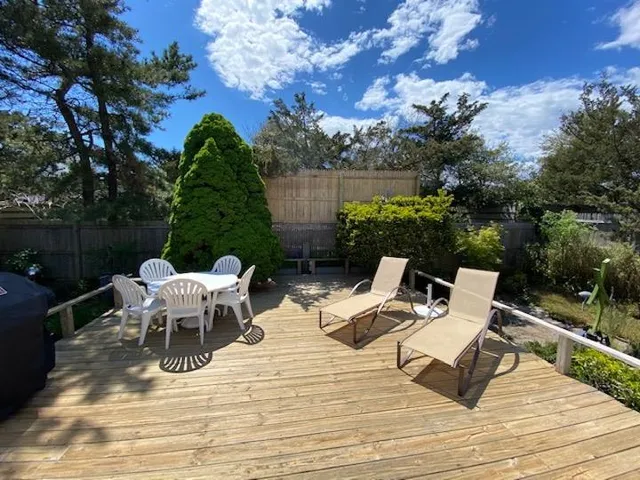 a view of a tables and chairs on the roof deck