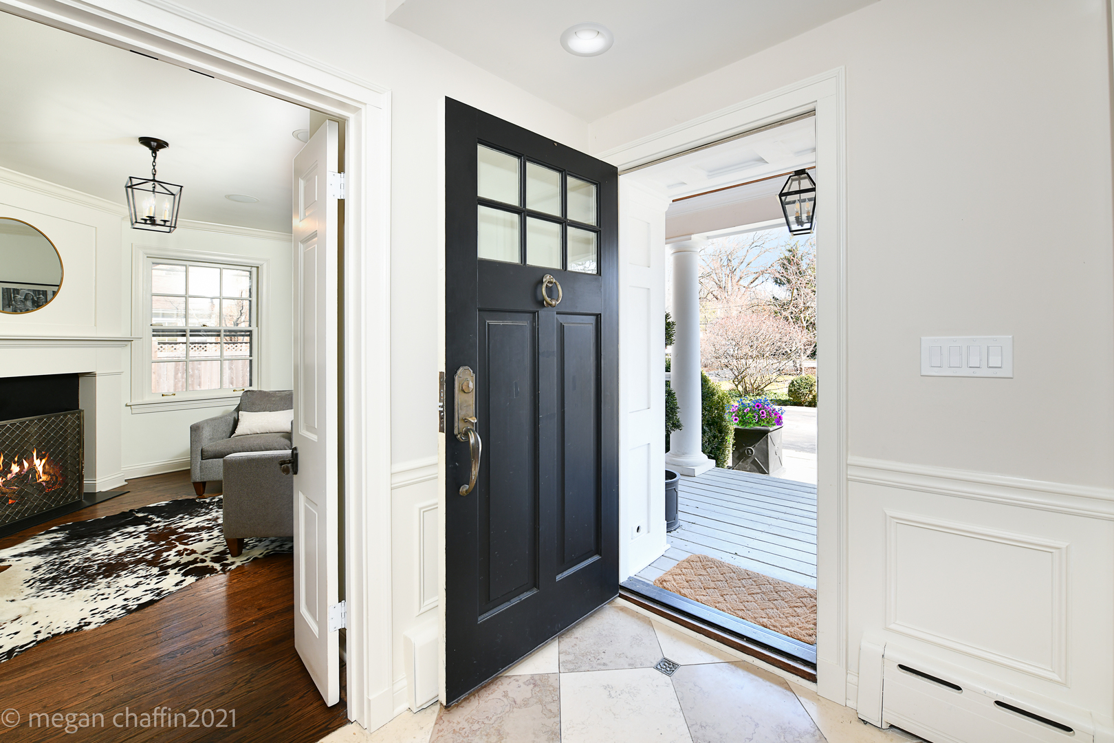 Undisclosed Address Winnetka, IL 60093 - Photo 12 of 38 a view of a hallway with wooden floor and a living room