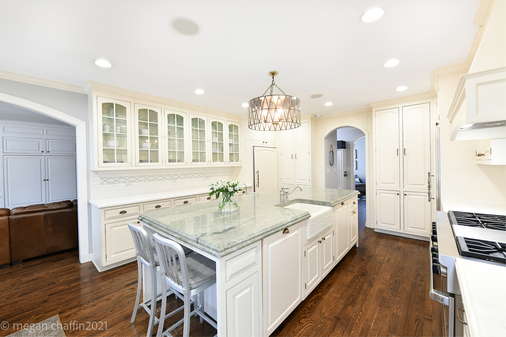 Undisclosed Address Winnetka, IL 60093 - Photo 16 of 38 a large white kitchen with sink a refrigerator and wooden floor