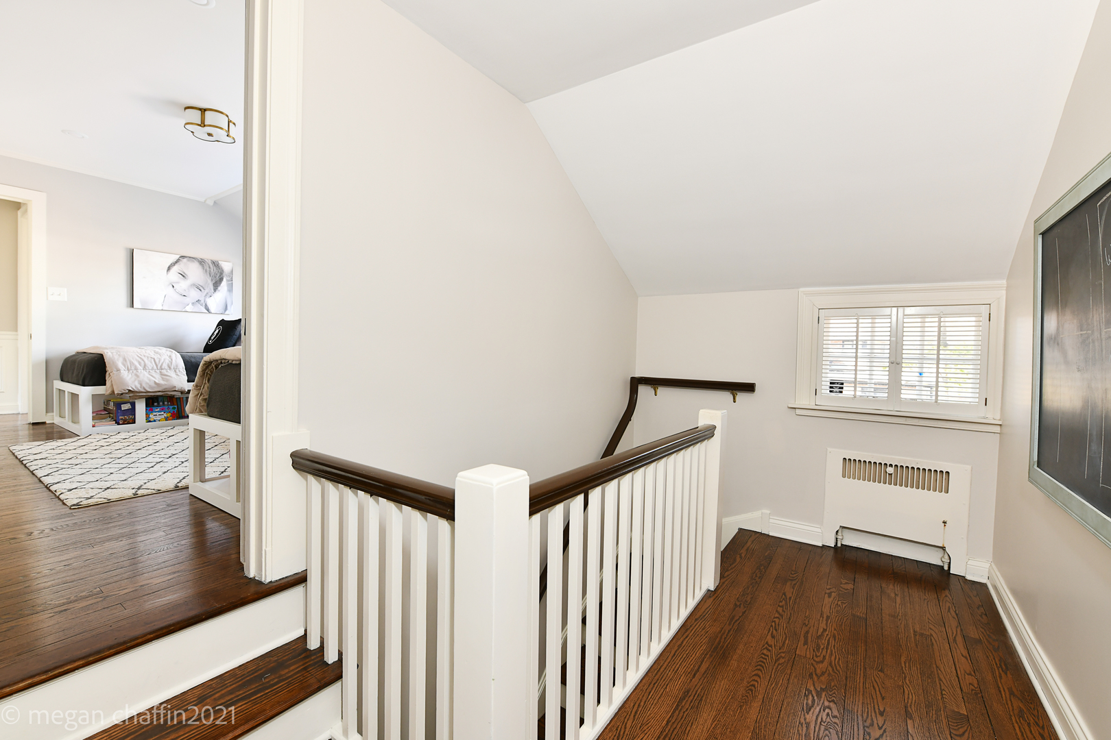 Undisclosed Address Winnetka, IL 60093 - Photo 25 of 38 a view of a hallway with wooden floor and dining room view