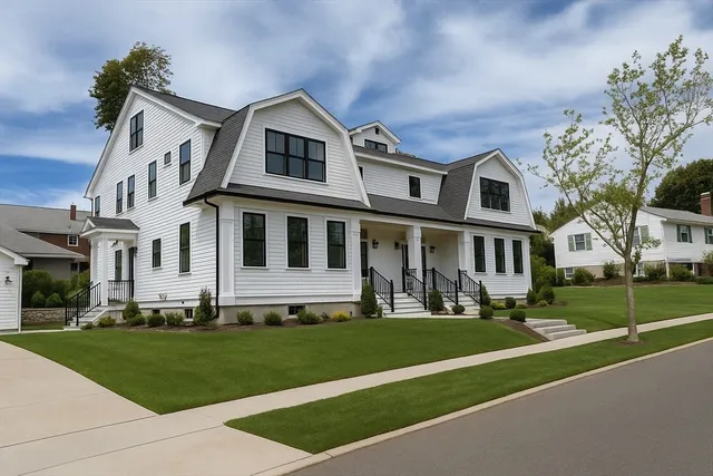 a front view of a house with a yard