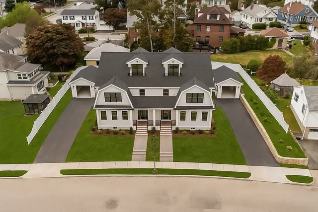 an aerial view of a house with swimming pool