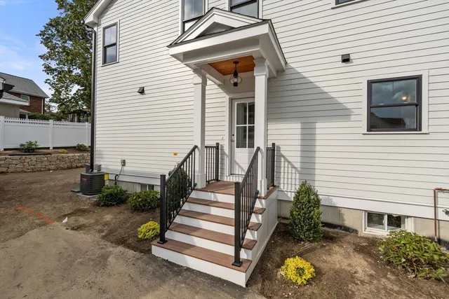 a view of a house with wooden fence