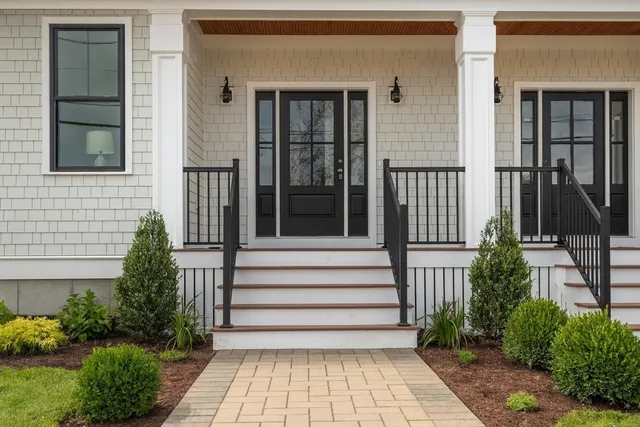 a view of a house with a window and garden