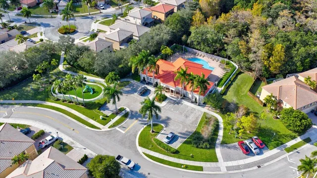 an aerial view of residential house with outdoor space and swimming pool
