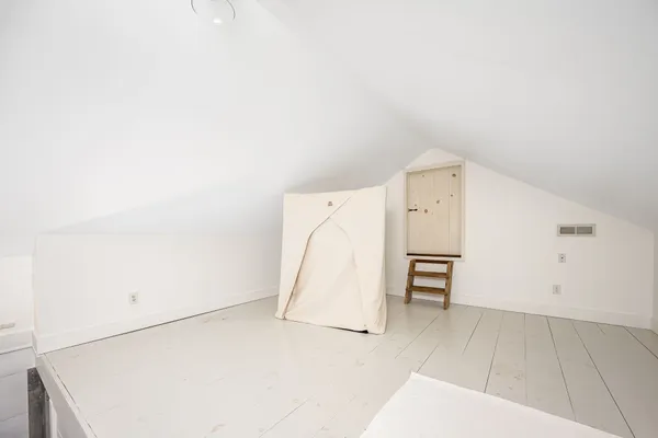 a bedroom with a bed and furniture