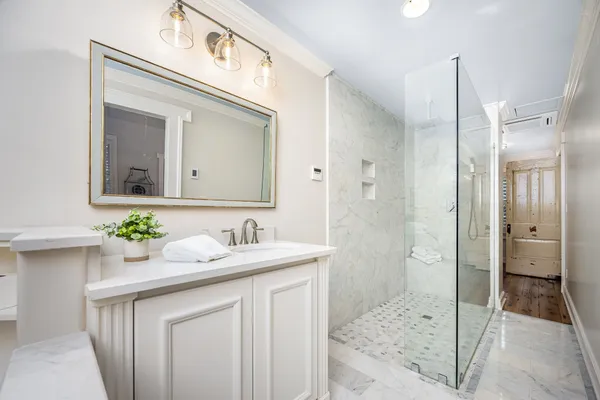 a bathroom with a granite countertop