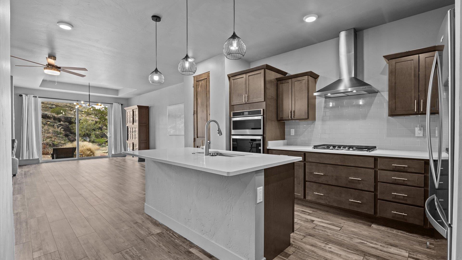 380 West Ridges Boulevard, Unit C Grand Junction, CO 81507 - Photo 13 of 42 a kitchen with stainless steel appliances granite countertop a sink a stove and a refrigerator