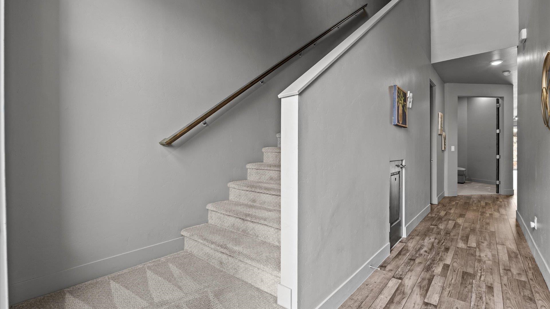 380 West Ridges Boulevard, Unit C Grand Junction, CO 81507 - Photo 19 of 42 a view of a hallway with wooden floor and staircase