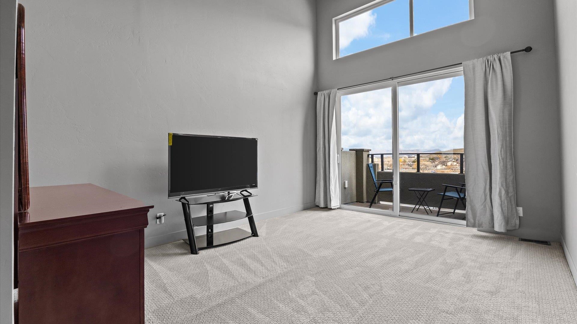 380 West Ridges Boulevard, Unit C Grand Junction, CO 81507 - Photo 20 of 42 a view of an empty room with furniture and a window
