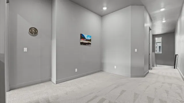 an empty room with windows and entrance