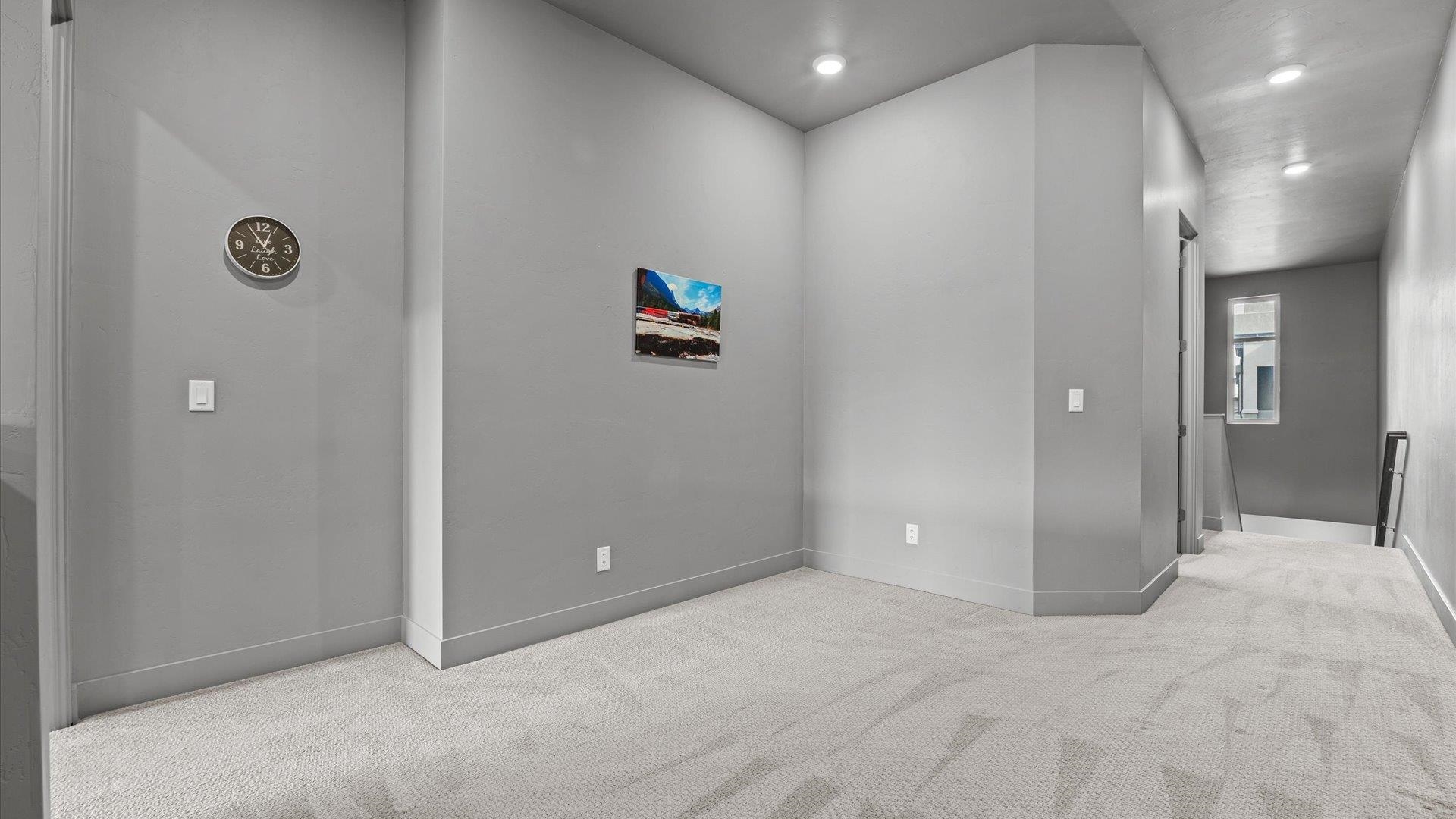 380 West Ridges Boulevard, Unit C Grand Junction, CO 81507 - Photo 25 of 42 a view of a hallway with wooden shelves