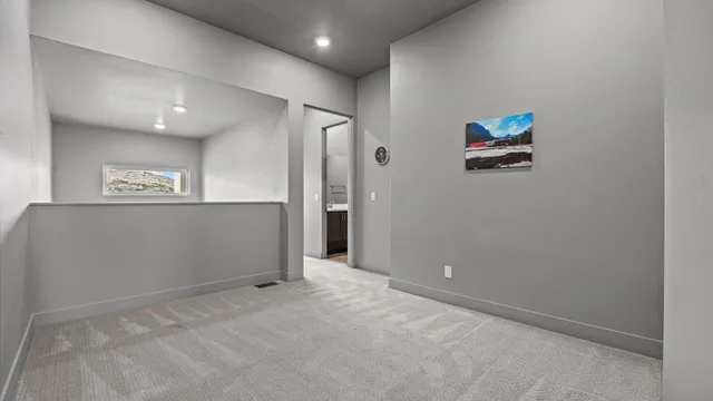 a bathroom with double vanity sinks and a large mirror