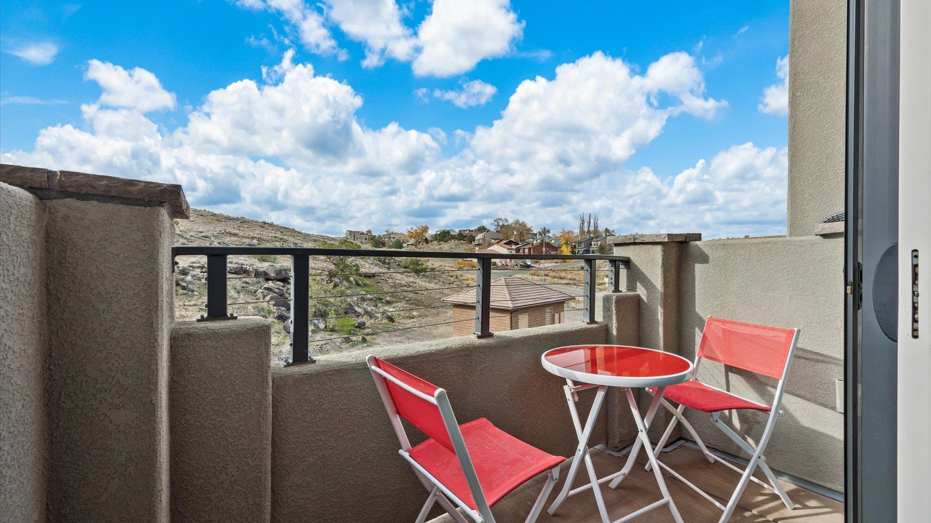 380 West Ridges Boulevard, Unit C Grand Junction, CO 81507 - Photo 32 of 42 a balcony with table and chairs