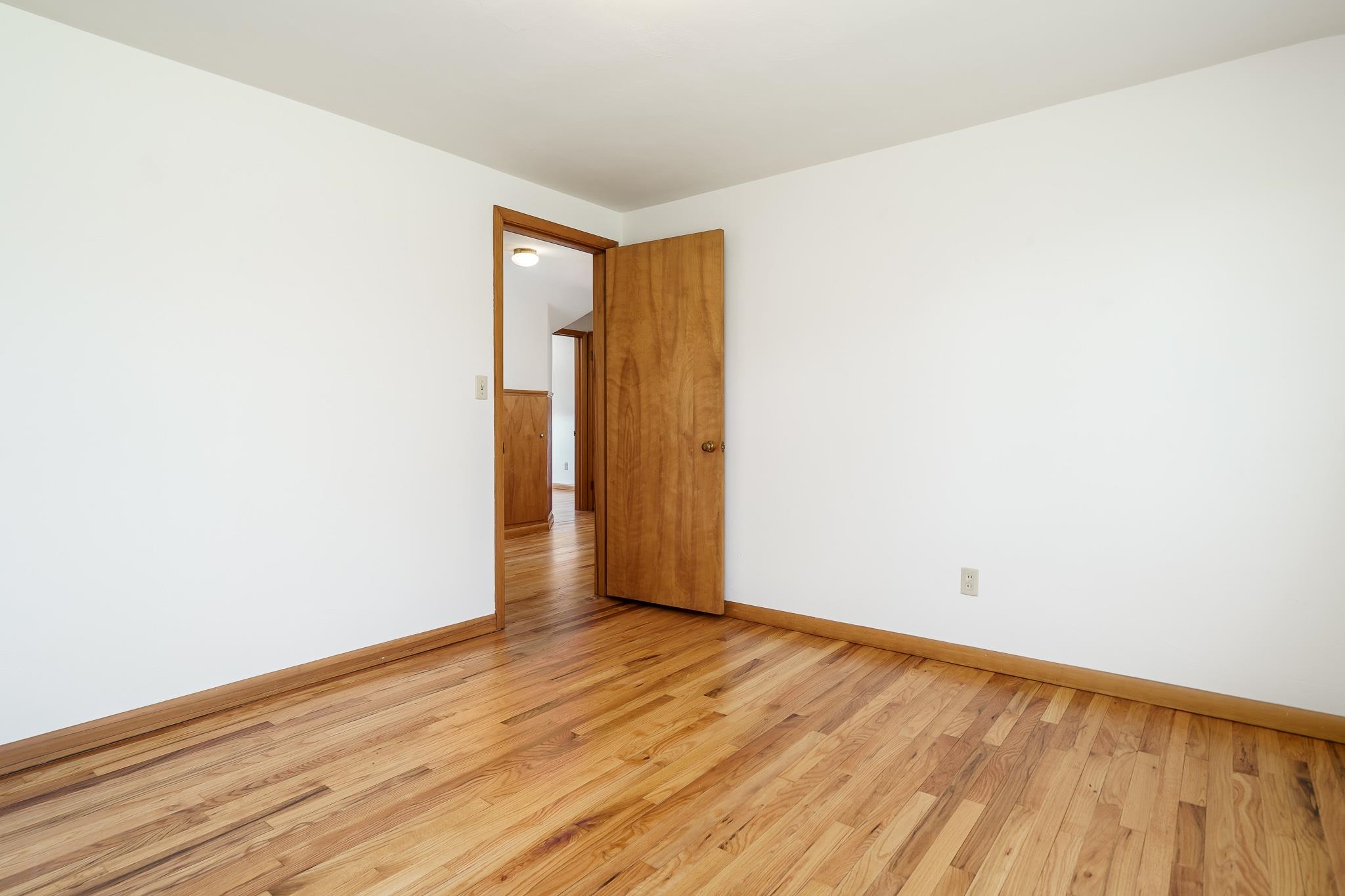 12407 Montague Road Winnebago, IL 61088 - Photo 33 of 43 a view of an empty room with wooden floor