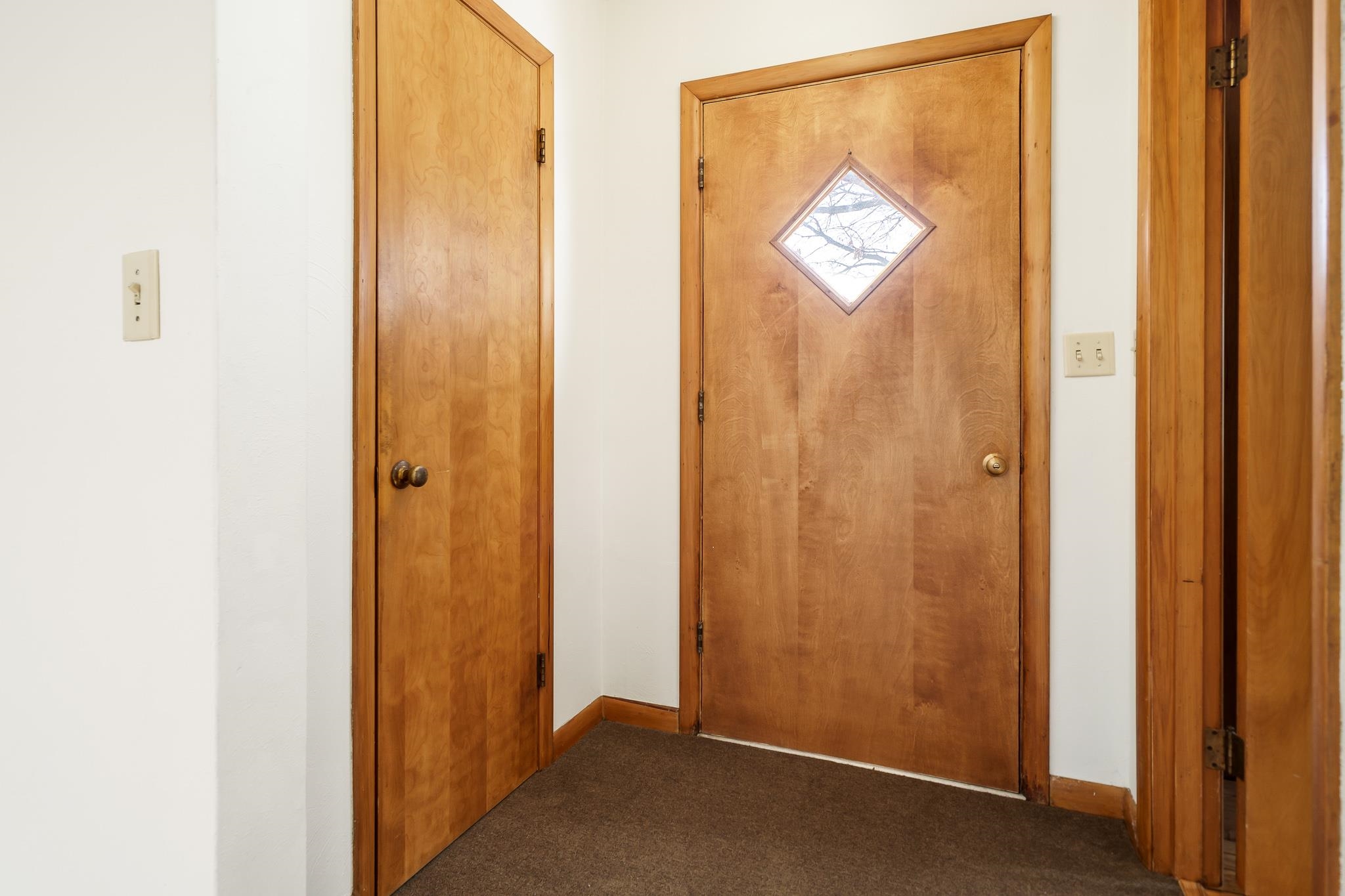 12407 Montague Road Winnebago, IL 61088 - Photo 8 of 43 a view of a hallway with a door and a window