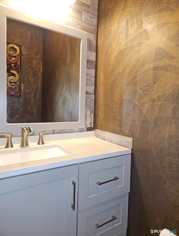 a bathroom with a sink and a mirror