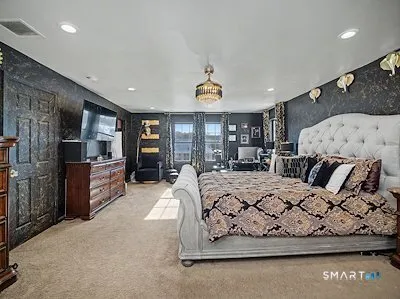 a living room with furniture fireplace and window